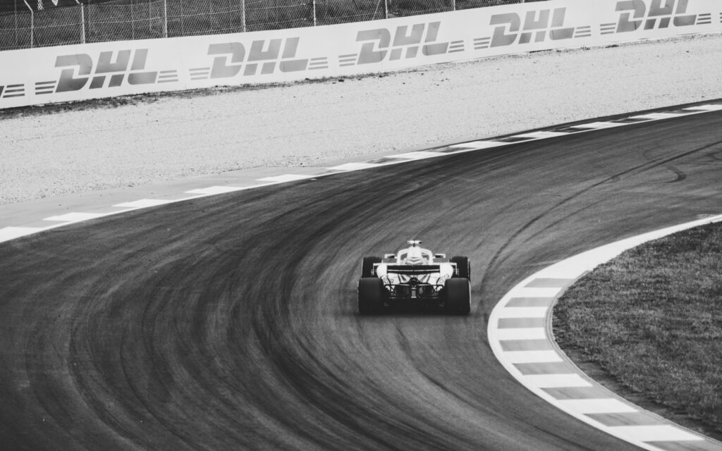 Formula 1 race photograph of car in black and white
